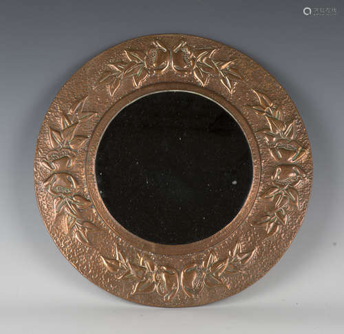 An early 20th Century Arts and Crafts copper circular wall m...