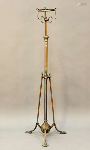 An Edwardian Arts and Crafts brass telescopic oil lamp stand...