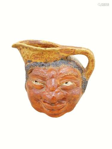 A MARTIN BROTHERS STONEWARE DOUBLE-SIDED FACE JUG