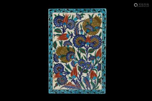 A 19TH CENTURY GLAZED POTTERY IZNIK TILE