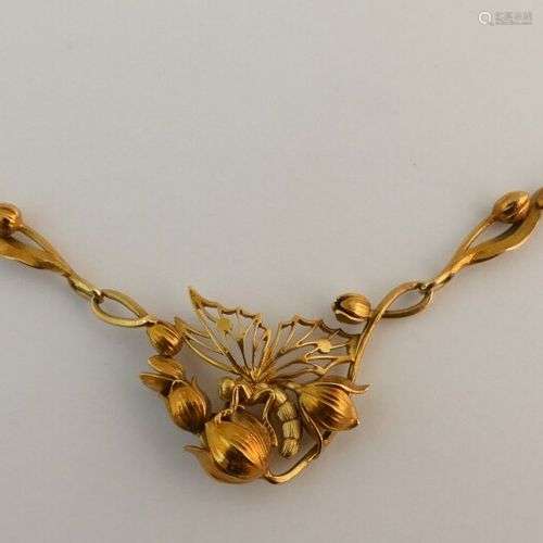 Collier en or jaune figurant un papillon sur une branche fle...