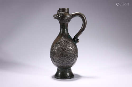 A bronze jug with a chicken spout