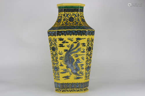 A blue and white Qianlong dragon and phoenix on a yellow bac...