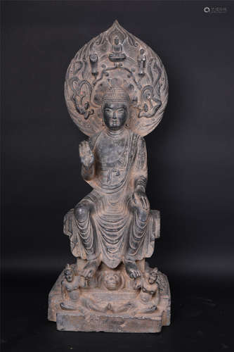 A carved stone Buddha statue