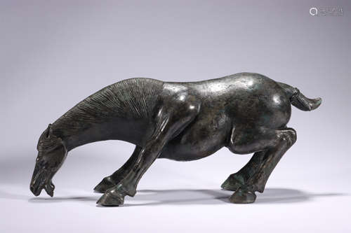 A bronze drinking horse