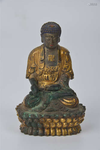 A bronze and gilt Buddha statue