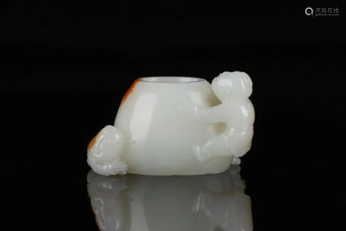 Qing Dynasty - White Jade with Russet Skin 'Child'