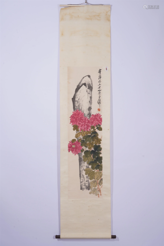 A CHINESE PAINTING OF FLOWERS AND ROCK
