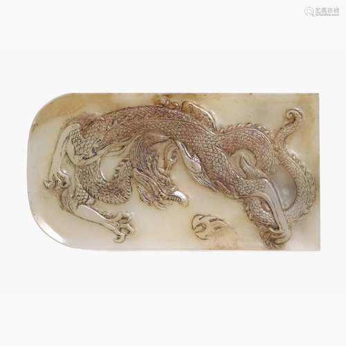 A Chines white jade belt buckle.