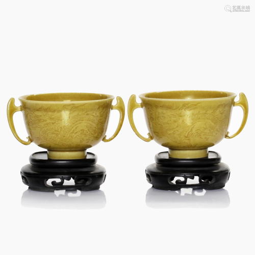 A pair of Chinese yellow glazed porcelain cups.
