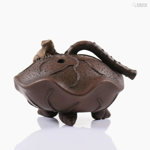 A Chinese yixing clay water pot.