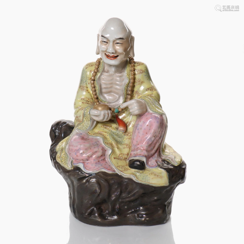 A Chinese famille rose porcelain figure.
