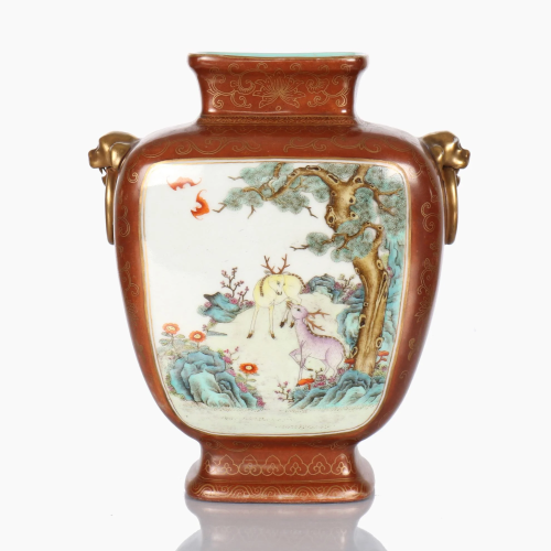 A Chinese porcelain coral-ground famille rose vase.