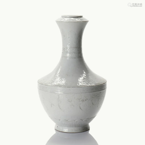 A small Chinese white glazed porcelain vase.