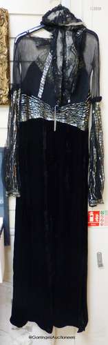 A late 1930's black silk velvet and silver evening dress and...