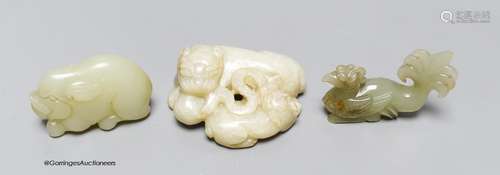 Three Chinese jade carvings of a wild cat and cub, a pig and...