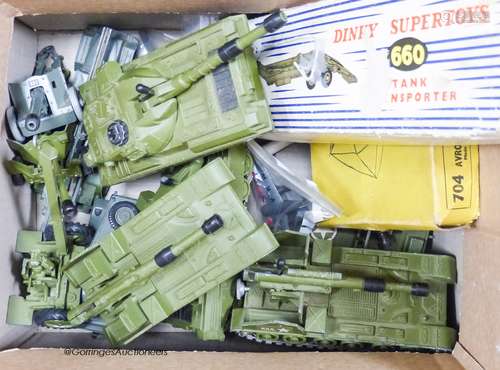 A collection of boxed Dinky military jeeps, cars and guns, e...