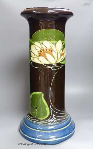 An Art Nouveau earthenware jardiniere, 53.5cm high