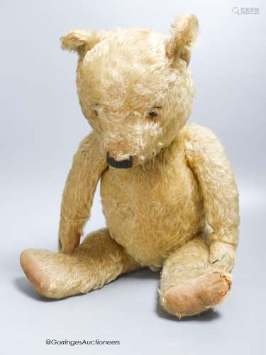 A blonde plush Teddy Bear with a hump back, height 51cm