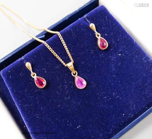 A modern 375 and ruby set drop pendant necklace, 46cm and pa...