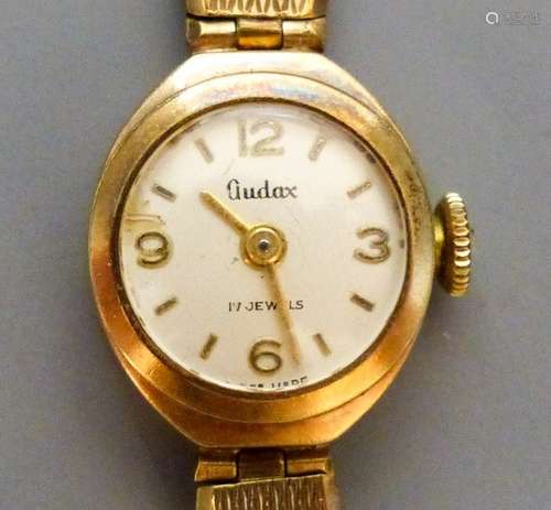 A lady's Audax 9ct gold manual wind wrist watch, on a 9ct go...