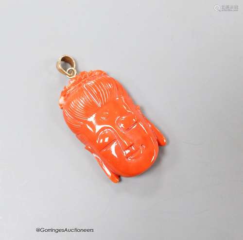 A Chinese 14k yellow metal mounted carved coral pendant, 35m...