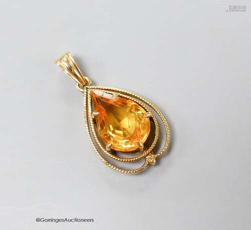 A 14k yellow metal and pear shaped citrine set drop pendant,...