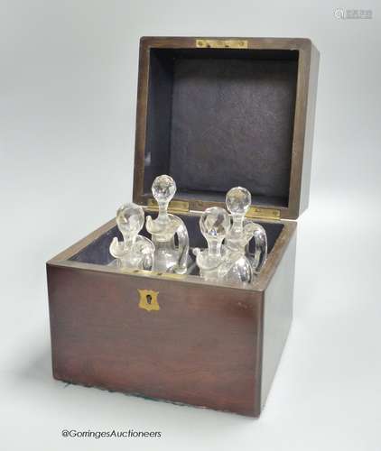 A Victorian rosewood case set of cut glass liqueur decanters...