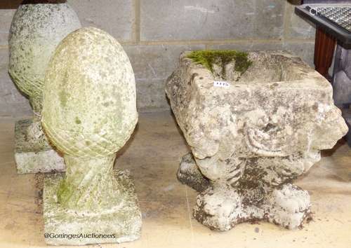 A pair of reconstituted stone acorn finials. H-42cm. Togethe...