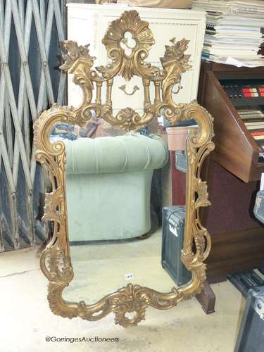 A reproduction rococo gilt mirror. W-48, H-84cm.