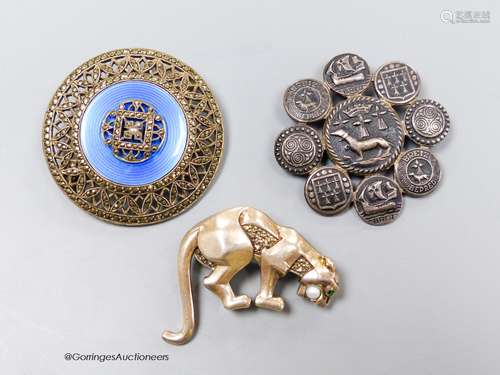 Three assorted brooches including a French white metal, marc...