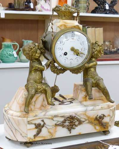 A 19th century gilt metal and marble French mantel clock, si...