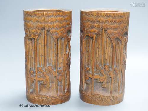 A pair of Chinese bamboo brush pots, carved with figures, si...