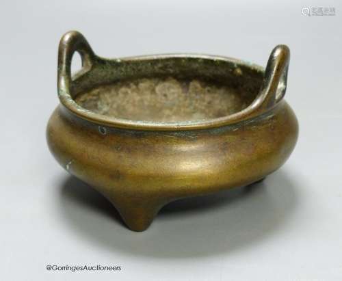 A 19th century Chinese circular bronze tripod censer, diamet...