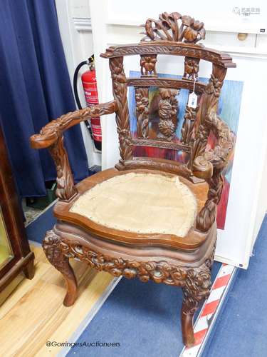 A Chinese carved elbow chair