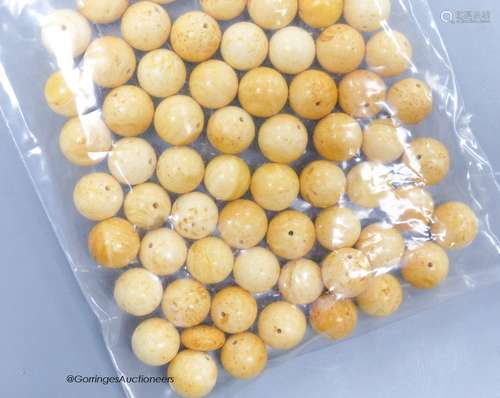 A quantity of loose amber prayer beads.