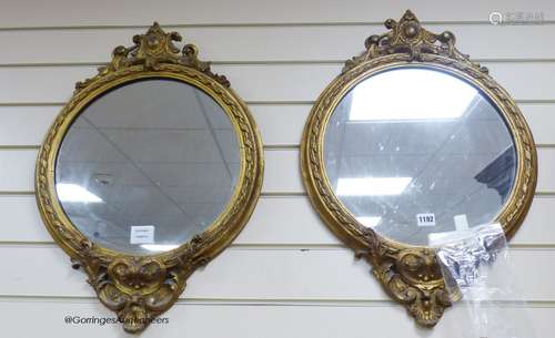 A pair of Victorian circular gilt wood and gesso wall mirror...