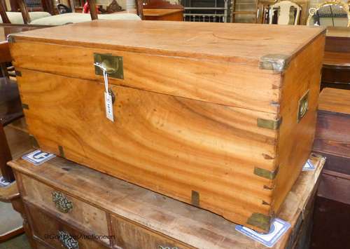 A small 19th century camphorwood trunk, fitted candle box to...