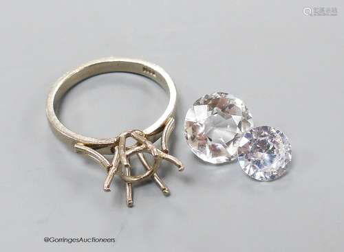 A white metal (stamped 18ct) ring mount, 4.1 grams and two u...