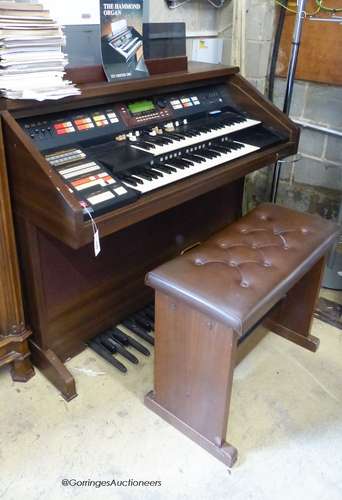 A Hammond organ, XT-100/XH-200 with stool and a quantity of ...