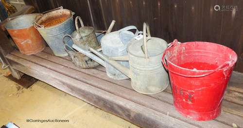 7 galvanised watering cans and buckets.