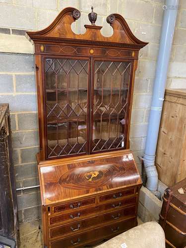 A good quality George III style inlaid and cross banded flam...