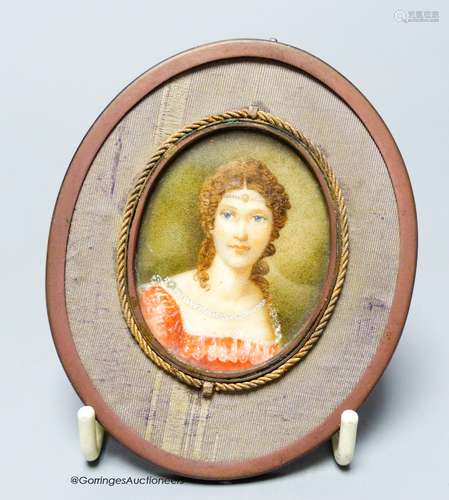 An oval framed miniature of a lady in red, height 5cm