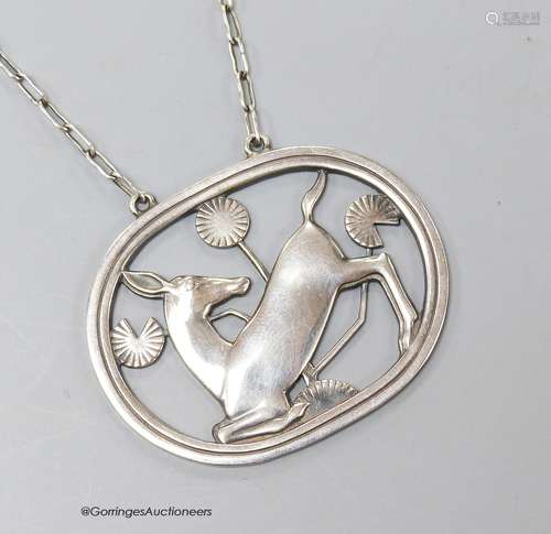 A George Jensen sterling 'kneeling deer' pendant necklace, d...