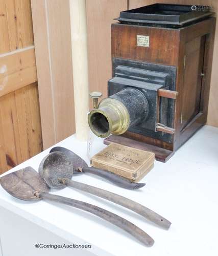 A Newton & Co Magic Lantern with slides and a group of three...