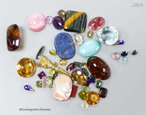 A small collection of unmounted mixed gemstones including ci...