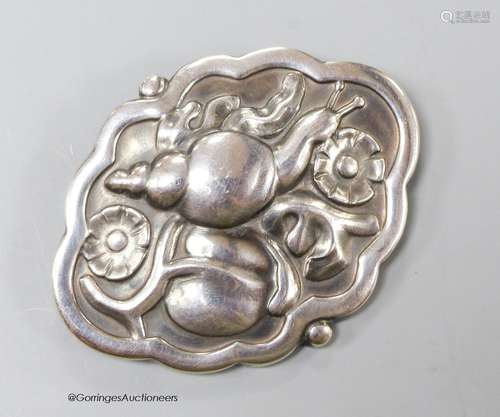 A Georg Jensen cartouche shaped sterling brooch depicting a ...