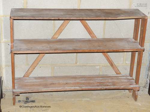 An Art nouveau pine three tier shelf or boot rack. W-108, D-...