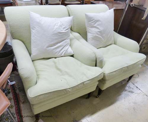 A pair of Howard style armchairs upholstered in lime green f...