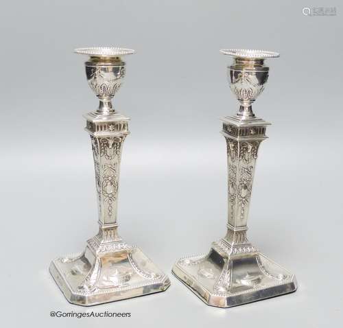 A pair of late Victorian Adams design silver candlesticks, S...